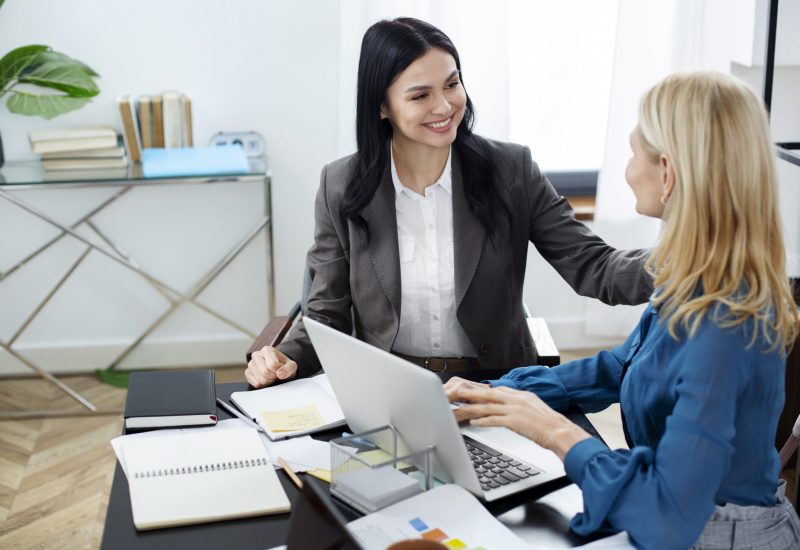 medium-shot-smiley-women-working-together (1)